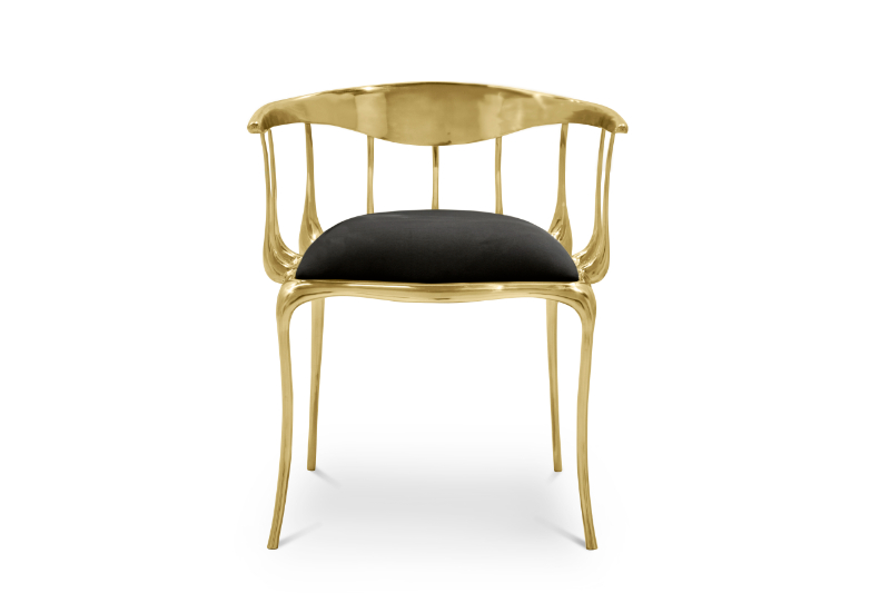 modern dining chair in a black colour with gold details.