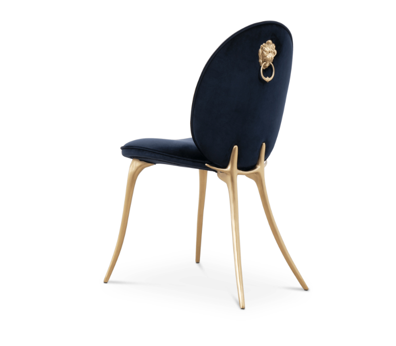A blue modern dining chair with the leon symbol in the back of the chair.