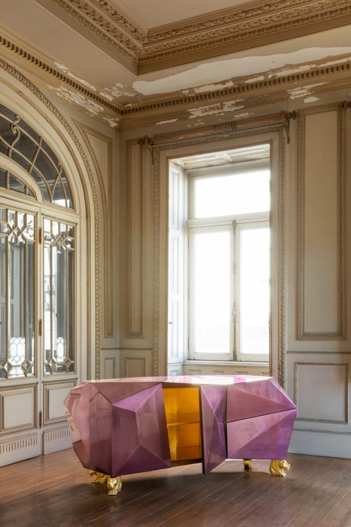 intimate luxury - brown door and a lilac sideboard with a golden lion-shaped base