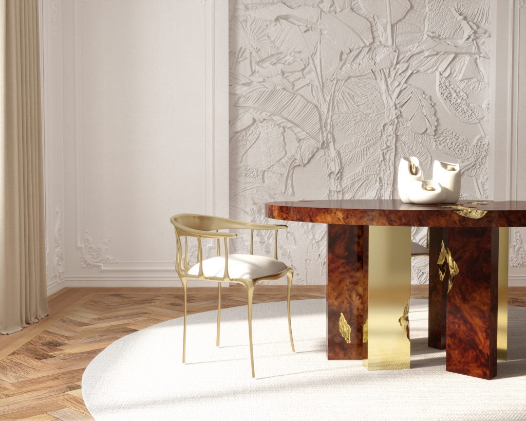 luxury dining tables. dining room with white walls, brown round dining table with gold details, gold and cream chairs, gold round hanging lamp